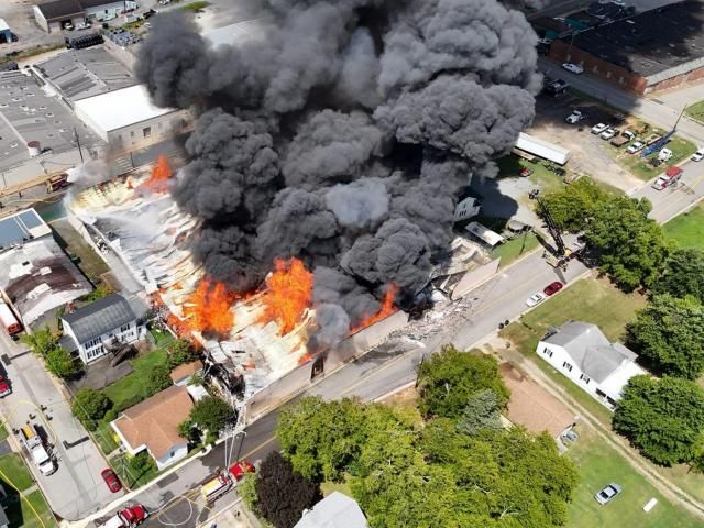 Crews battle South Hill fertilizer warehouse fire in sweltering heat