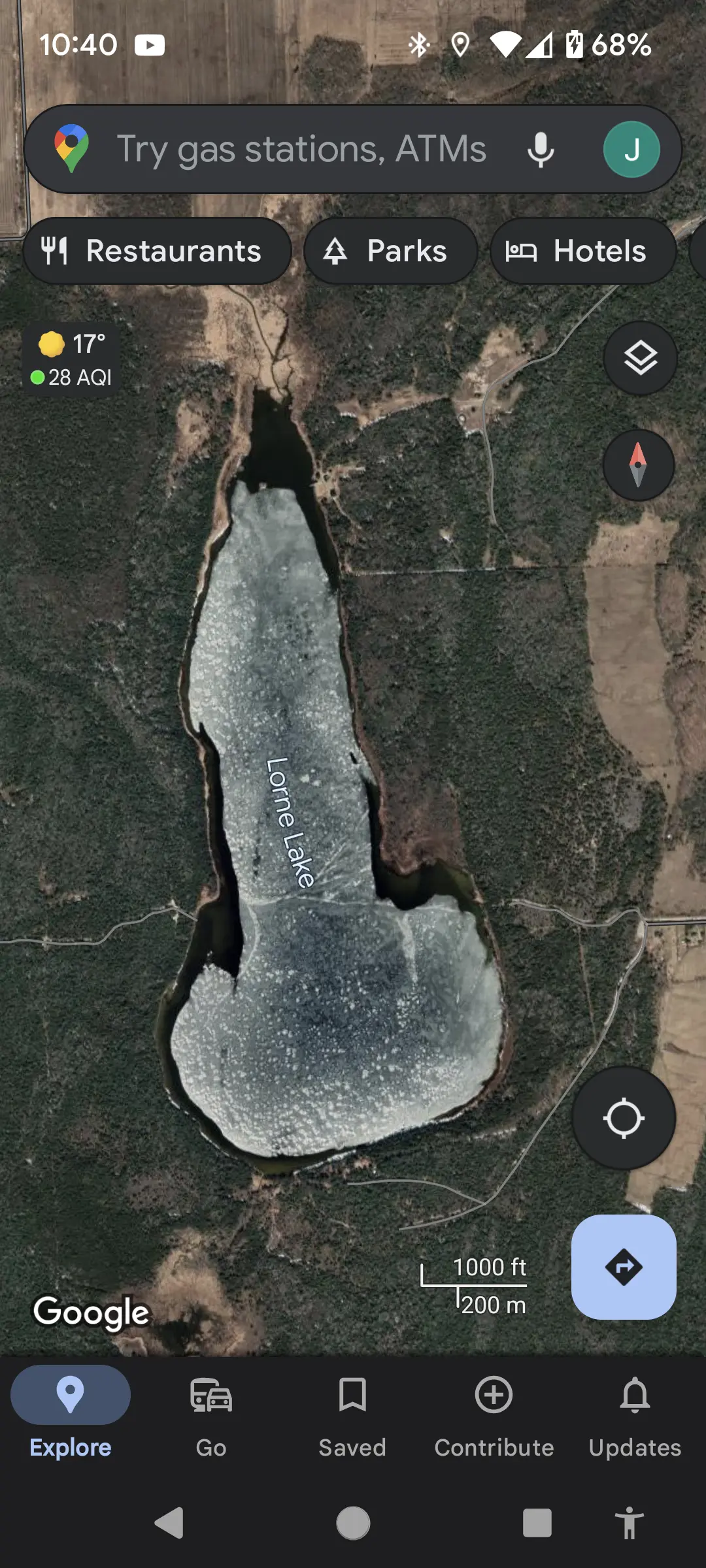 A maps screen capture of a satellite view of a lake. The lake is mostly frozen, with an end of water around it. It's shaped like a penis. The name of the lake is Lorne Lake. It's surrounded by forest.
