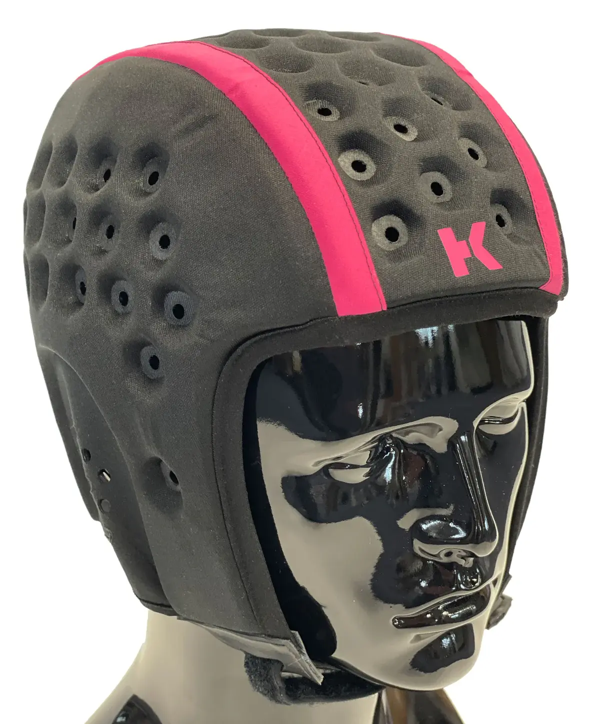 A mannequin head wearing a Hedkayse Headguard, which resembles a traditional rugby scrumcap.