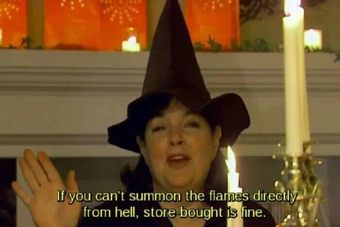 Ina Garten, a TV cooking show host, wearing a witches hat and surrounded by candles. The caption says "if you can't summon the flames directly from hell, store bought is fine"