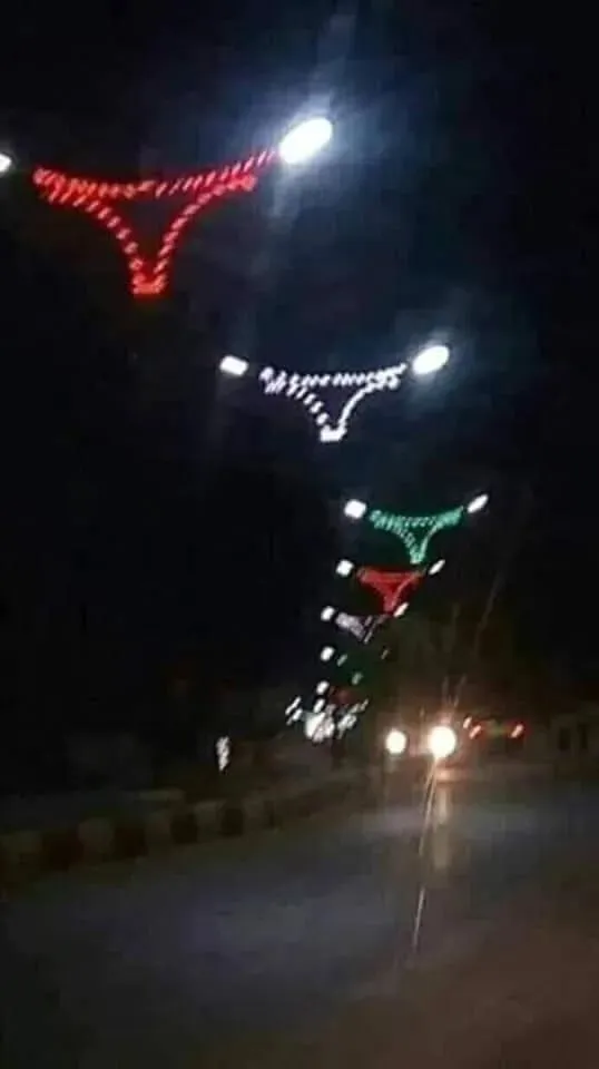 Street lights' LED decorations in the shape of a V-string