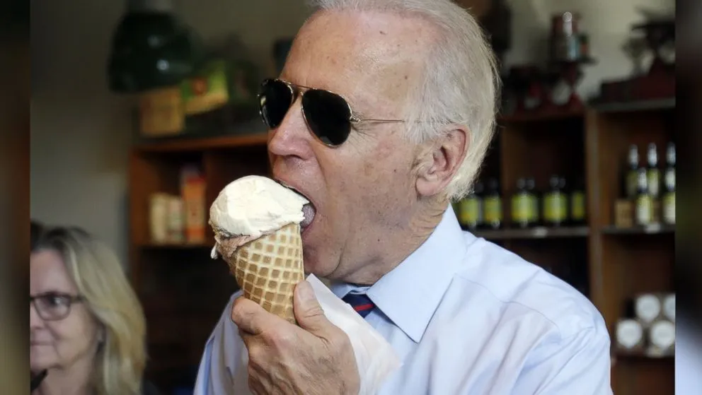 photo of President Biden eating ice cream while wearing ray ban sunglasses