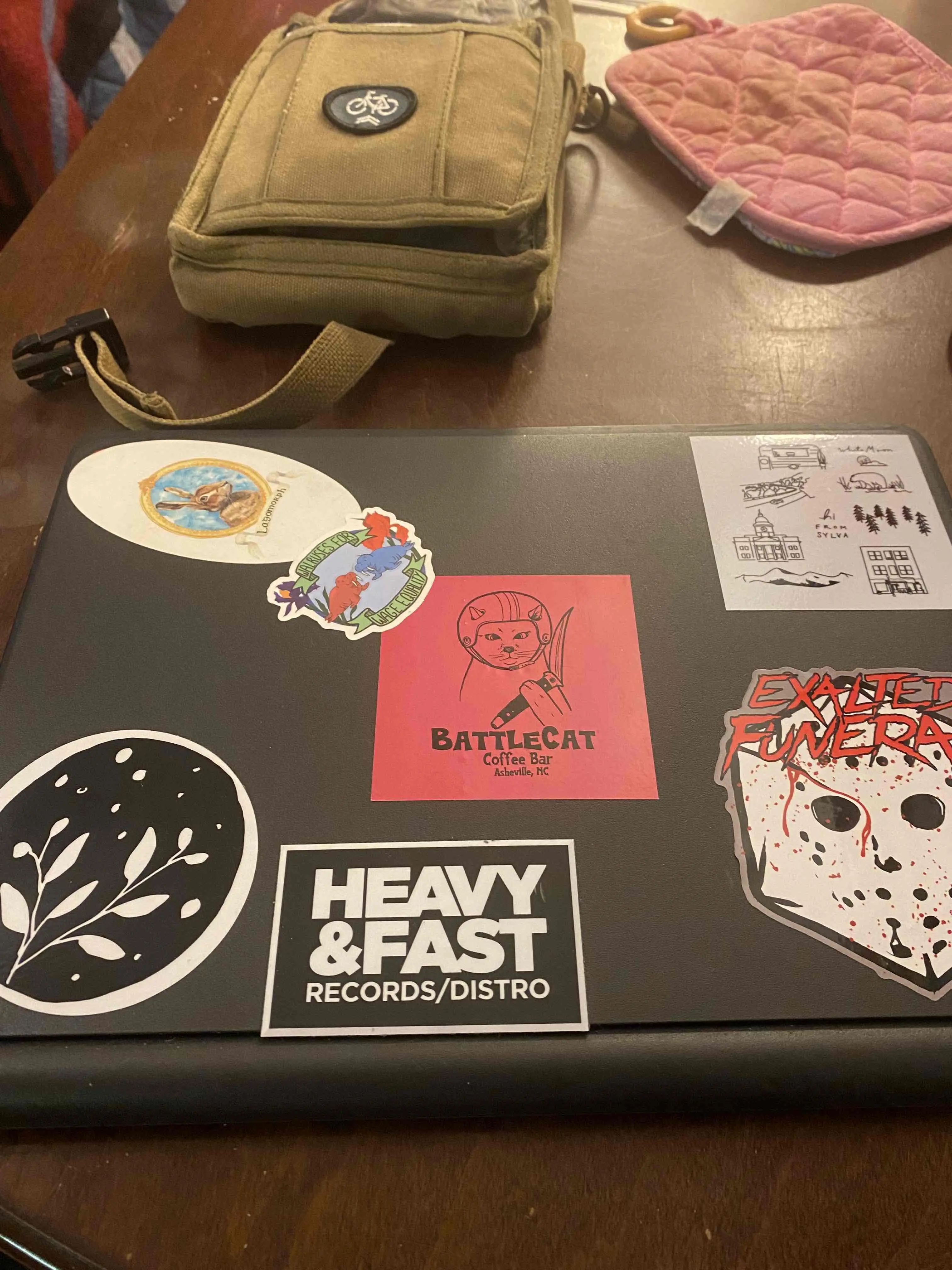a modified chrome book covered in stickers